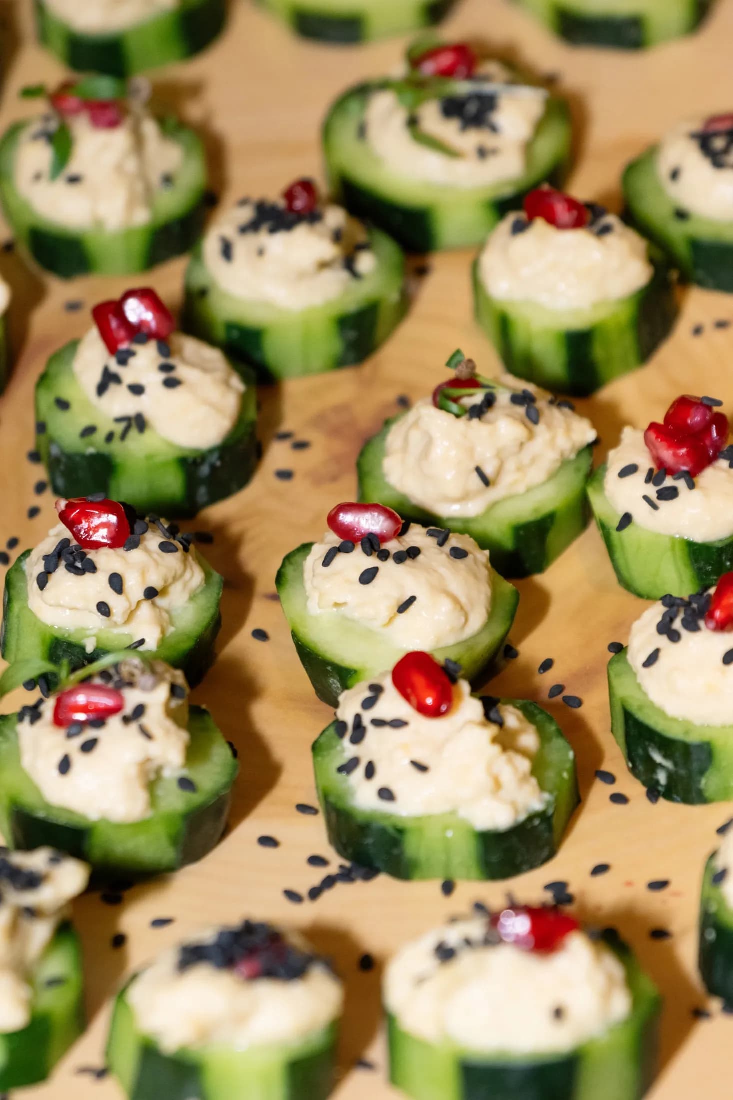 Cucumber canapés with sesame and pomegranate