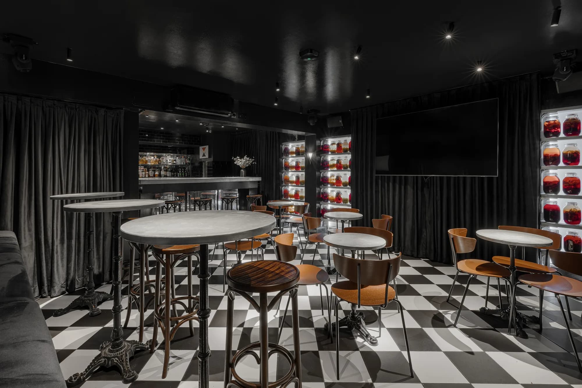 Screens and seating in the ZIMA karaoke bar